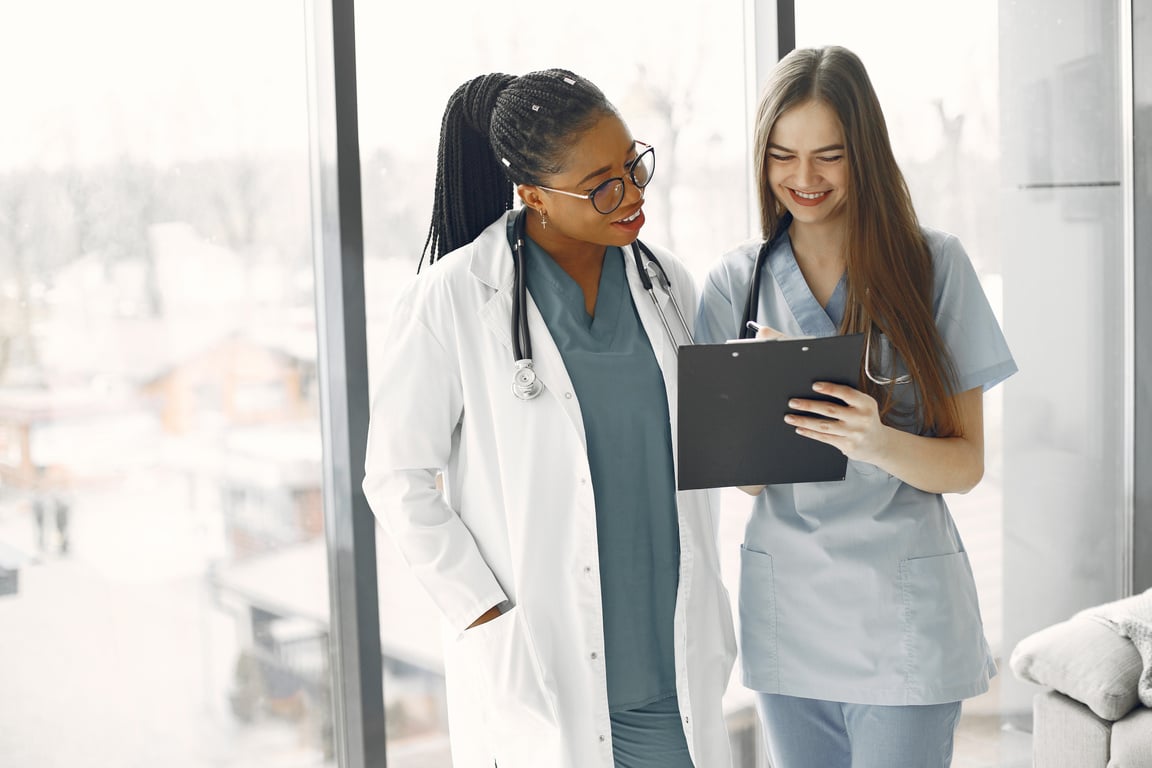 Healthcare Professionals Looking at the Document on the Clipboard